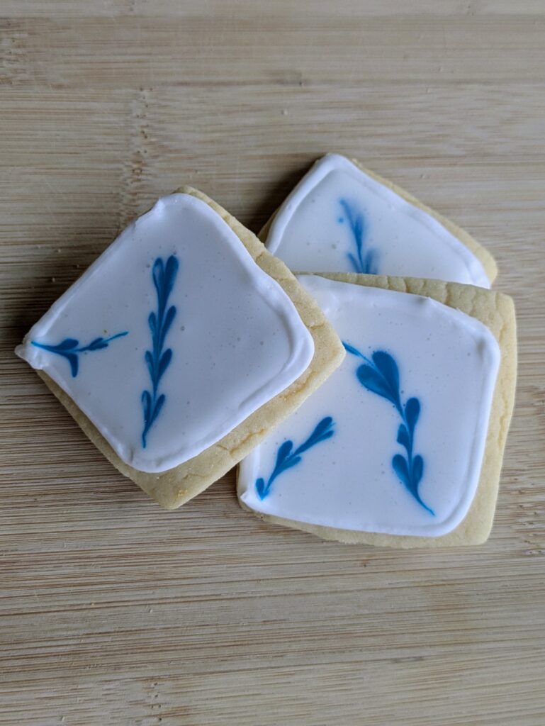 blue and white frosted sugar cookie
